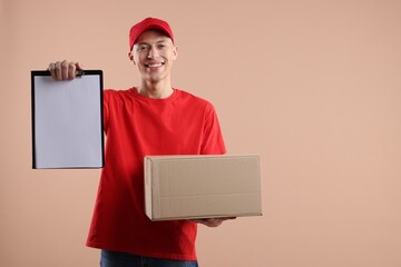 Wall Mural - Happy courier with parcel on beige background. Space for text