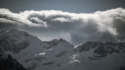 Wall Mural - strong south wind and foehn clouds in the alps at a sunny spring day in the national park hohe tauern in austria