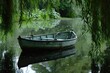 Small Boat Floating on Clear Blue Lake, A vintage row boat floating idly over a mirror-like pond, under hanging willow branches, AI Generated