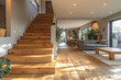 a modern interior design, a wooden staircase with handrail and an open plan living room in the background