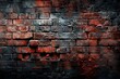 A red brick wall stands out against a stark black backdrop, creating a striking contrast. The texture of the bricks adds depth and character to the scene