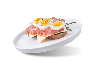 Wall Mural - Salami sausages arugula cheese egg rye bread sandwich on a white isolated background