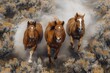 Three majestic horses caught mid-gallop through a dusty plain surrounded by brush and sagebrush
