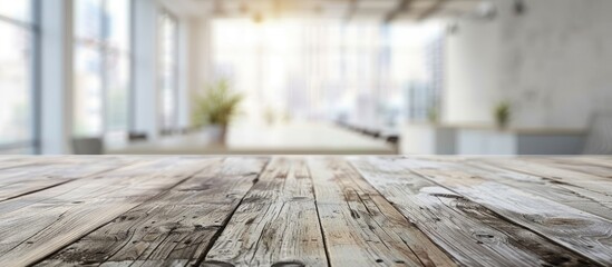 Canvas Print - A hardwood table with a blurred living room background, showcasing the parallel lines of the wood flooring and creating a warm city feel