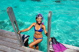 Fototapeta Tęcza - Travel Vacation Snorkeling. Snorkel swim woman in tropical coral reef resort. This image is completely unretouched and unedited and model is with no makeup. Authentic real people. Original Raw Image