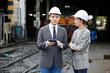 © offsuperphoto - businesspeople talking and checking train on construction site