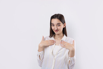 Young beautiful woman with facial expression of surprise standing over white background.