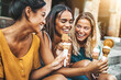 © Davide Angelini - Happy women eating ice cream walking on city street - Happy group of friends enjoying summer vacation in Italy