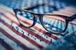 American economy concept with eyeglasses - Close-up focus on eyeglasses overlayed on a US flag motif with economic stock graphs in the background