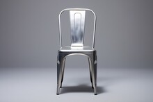 A Silver Metal Chair With A Backrest