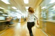 Woman rushing through an office hallway with motion blur effect