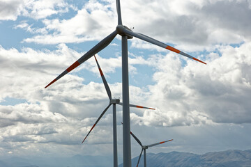 Wind farm or wind park at sunset located in the mountains of Italy Europe to realize clean energy. It’s sustainable, renewable energy for enviromental. Iconic location for landscape photographers blog