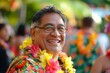 Cheerful elderly man wearing a colorful Hawaiian shirt and lei smiles at a festive outdoor event