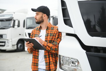 Wall Mural - Men driver near lorry truck. Man owner truck driver near truck. Man trucker trucking owner. Transportation industry vehicles. Handsome man driver front of truck.