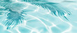 Tropical leaf shadow on water surface. Shadow of palm leaves on blue water. Beautiful abstract background concept banner for summer vacation at the beach.	