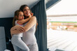 © DusanJelicic - pregnant mom hugs her daughter tightly, they look happy and loved