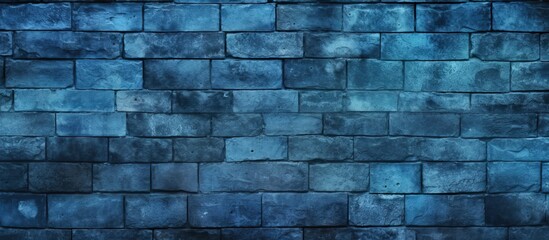 Wall Mural - A close up of an electric blue brick wall with a dark background showcasing a vivid azure pattern. The rectangular bricks create a stunning contrast against the grey stone wall