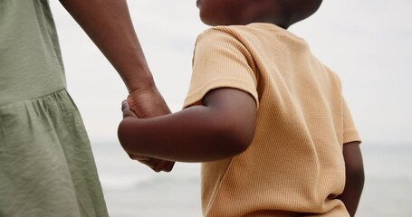 Canvas Print - Mother, kid and holding hands on beach for support, bonding and holiday with closeup. Back of parent, mom or family with child by the ocean, sea or water in nature for love, care and explore together