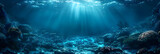 Fototapeta Do akwarium -  Deep blue ocean floor with reefs. Empty ocean bo,
Abstract blue backdrop with blue water and underwater sun rays in the ocean
