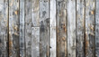 A wooden wall with many holes and splinters. The wood is old and worn, giving the impression of a rustic, natural setting. Blank wooden board background.