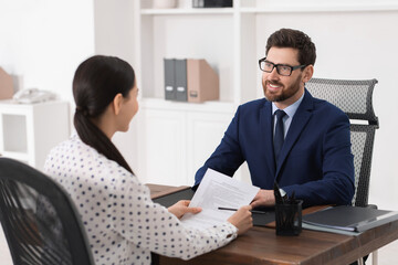 Wall Mural - Woman having meeting with lawyer in office, selective focus