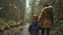 As they stroll through a tranquil forest a child and their parent take a deep breath in and let it out slowly. The child feels their worries slowly melting away as they connect