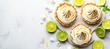 Delicious key lime pie and lemon meringue tart on pristine white surface