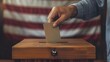 Male Voter Casting Ballot into Flag-Background Box during Presidential Election, USA
