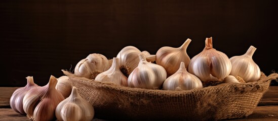 Poster - Garlic bulbs in a wicker basket