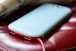 Blue Cell Phone on Red Chair