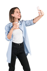 Woman in casual wear taking a selfie with her phone while holding a coffee cup, isolated on a white background. Lifestyle concept