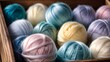 Closeup image of colorful wool yarn balls in box. Multi-colored threads for knitting	
