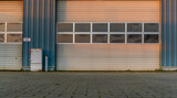 Fototapeta Kwiaty - Garage door in an industrial building
