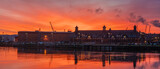 Fototapeta  - Port buildings in Szczecin during spectacular sunrise