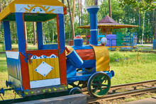 Multi Colored Children's Train For Children To Ride In A Summer Amusement Park