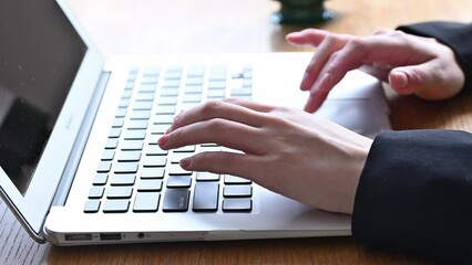 Animation of a woman's hand typing on a computer in business, without face.