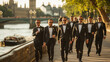 A group of men in suits on the banks of the Thames, London.