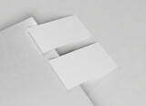 Fototapeta Kosmos - Two white business card Mockup. Textured calling card template on a blank surface. 3D rendering