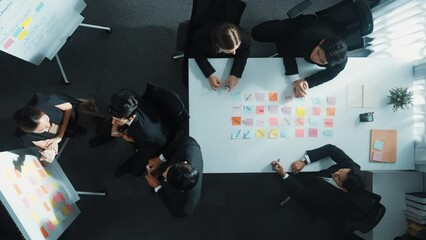 Poster - top down aerial view of business group sharing and brainstorming idea by using sticky notes at meeti
