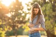 © mirifadapt - Girl holding her stomach in pain, suffering from stomach pain
