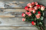 Fototapeta Kwiaty - bouquet of roses on wooden background