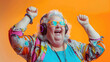 Happy eccentric fat old woman in headphones wearing colorful clothes and rejoices happiness elderly age diversity concept