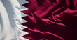 Close-up of the national flag of Qatar flutters in the wind on a sunny day