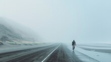 Minimalist Landscape, Road Beside Beach, Triathlete Riding Bike, Centered In Frame, Fog And Haze, Copy And Text Space, 16:9