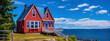 Small red house with white picket fence by the ocean