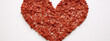 Red felt hearts arranged in a heart shape on white background.