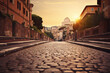 Cobblestone street in Rome, Italy with a view of the Castel Sant'Angelo at sunset in warm colors