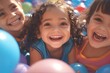portrait of happy little kids in ball pit having fun in children play center