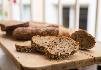 Wall Mural - fresh loaf of bread on wooden board