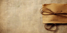 Vintage paper letter or manuscript tied with rope on sackcloth background